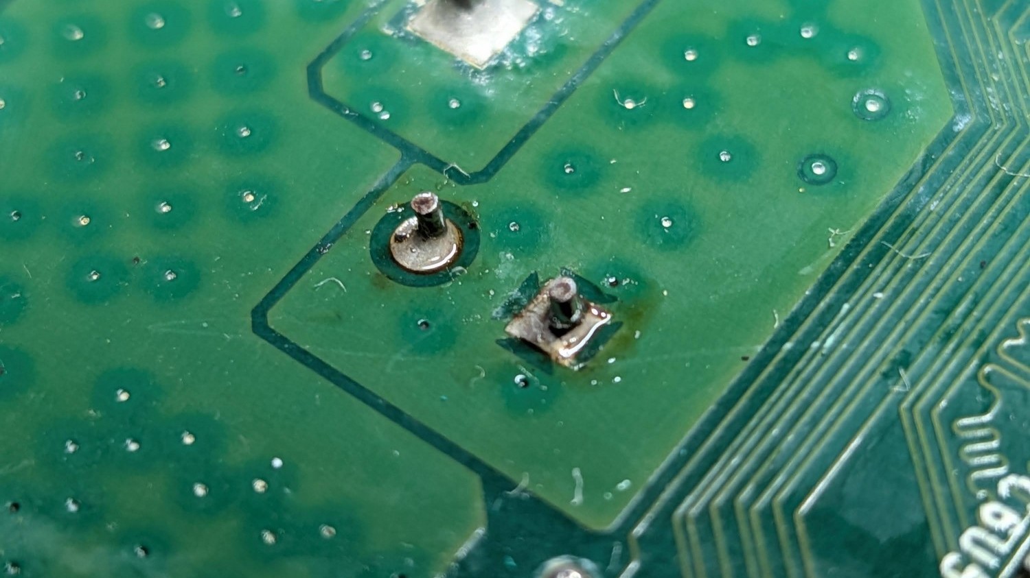the solder points of the capacitor, impervious to my weak soldering iron
